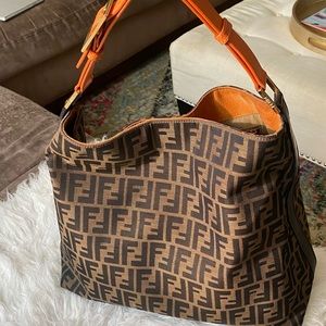 Fendi zucca canvas large hobo bag with leather buckle strap.